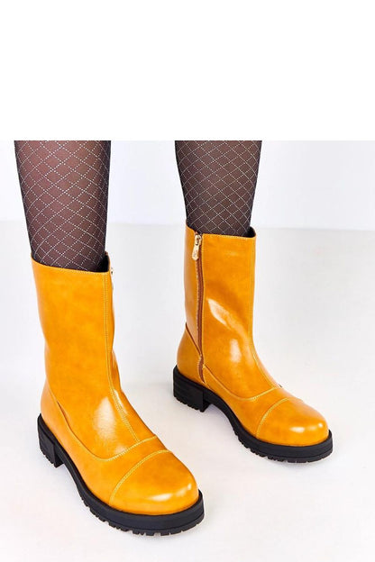 Stylish Solea ankle boots for women in radiant orange, crafted with high-quality materials and equipped with a durable zipper for easy wear.