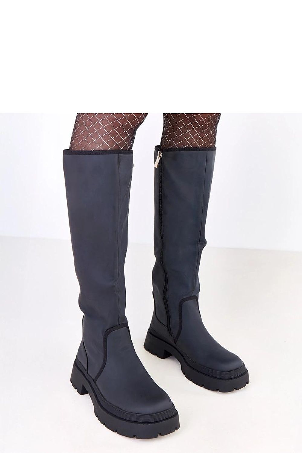 Solea's luxurious faux leather thigh-high boots with a knee-high shaft, showcasing a sophisticated round toe and insulated interior.