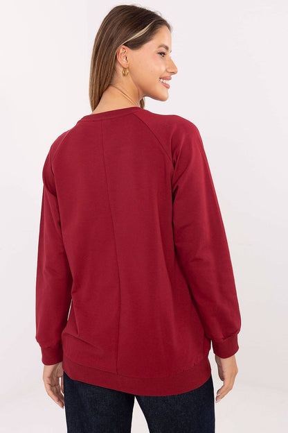 Side view of Relevance's women's casual sweatshirt, highlighting the long sleeves and soft cotton blend fabric, ideal for a sophisticated yet relaxed outfit.