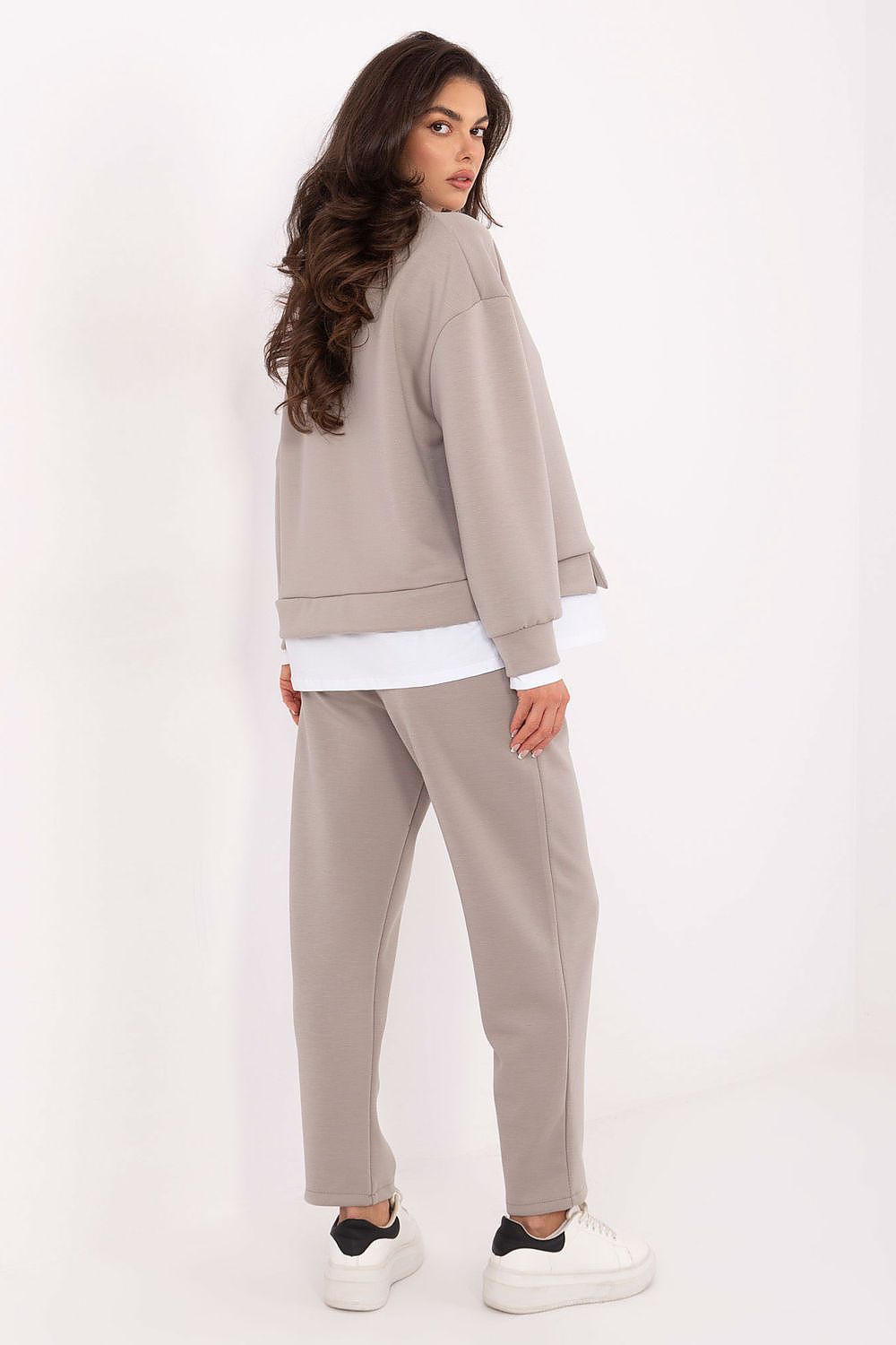 Stylish Rue Paris women's casual set showcasing high-waisted trousers, delicate design, and luxurious soft material perfect for modern elegance.