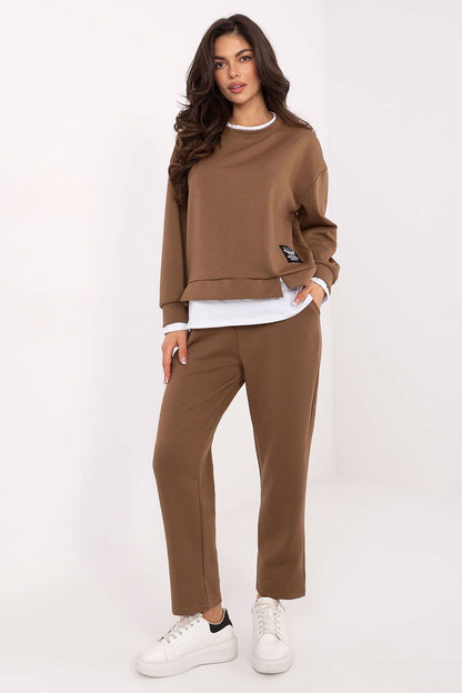 Luxury women's hoodie and high-waisted pants set by Rue Paris, showcasing soft viscose and elastane fabric in a stylish design.