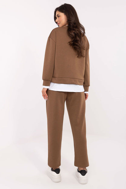 Elegant luxury women's athleisure set by Rue Paris, featuring comfortable high-waisted trousers and a chic hoodie for a fashionable everyday look.