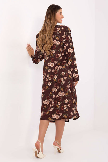 Elegant midi dress by Rue Paris featuring a floral pattern, shoulder pads, and draping details, perfect for chic occasions.