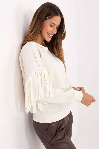 Elegant women's blouse from Rue Paris with eye-catching fringes and stud details, made from smooth viscose and polyester, showcasing a classic round neckline in EU size 0.