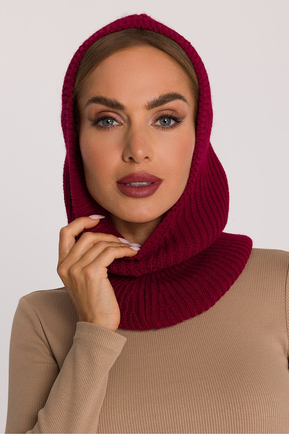 Moe luxury balaclava styled on a model, demonstrating its sleek silhouette and warm coverage for outdoor elegance.