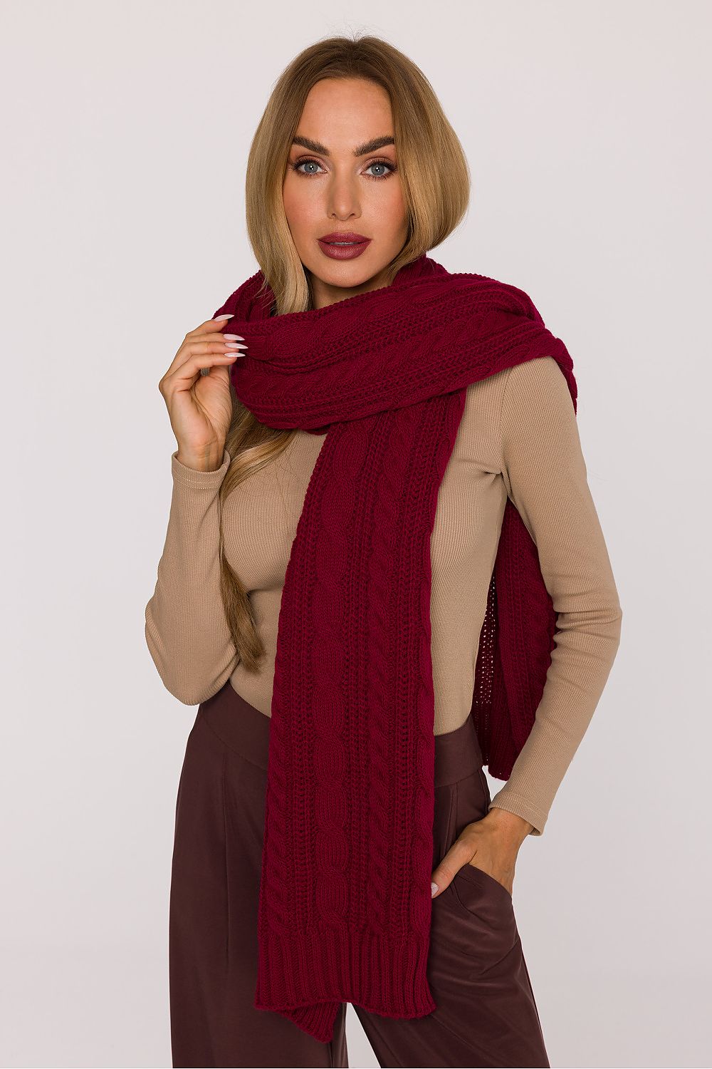 Moe's luxury long scarf elegantly draped, highlighting the warm and soft fabric ideal for cold weather styling, with a timeless braided design.