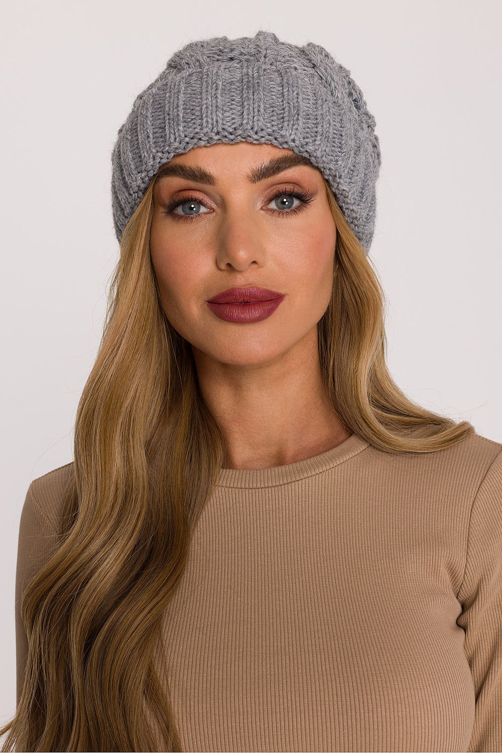 Luxury braided knit cap by Moe, crafted from soft yarn, showcasing a thick braided knit and elegant design for ultimate winter warmth and style.