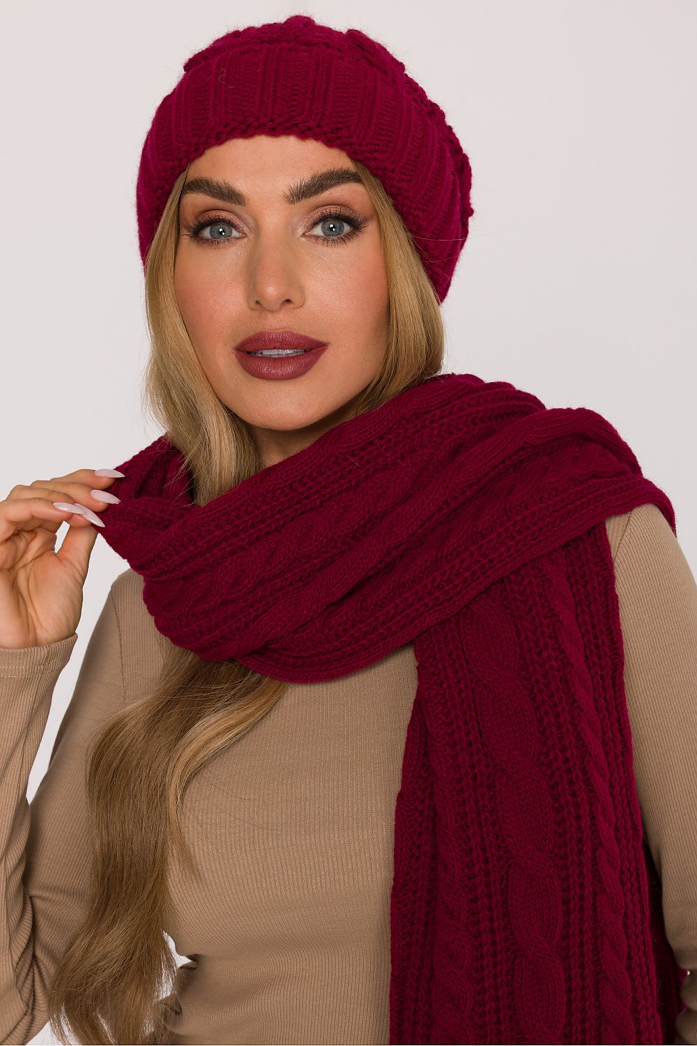 Close-up of Moe's Luxury Braided Knit Cap, highlighting its soft yarn texture and intricate braided knit for a chic winter accessory.