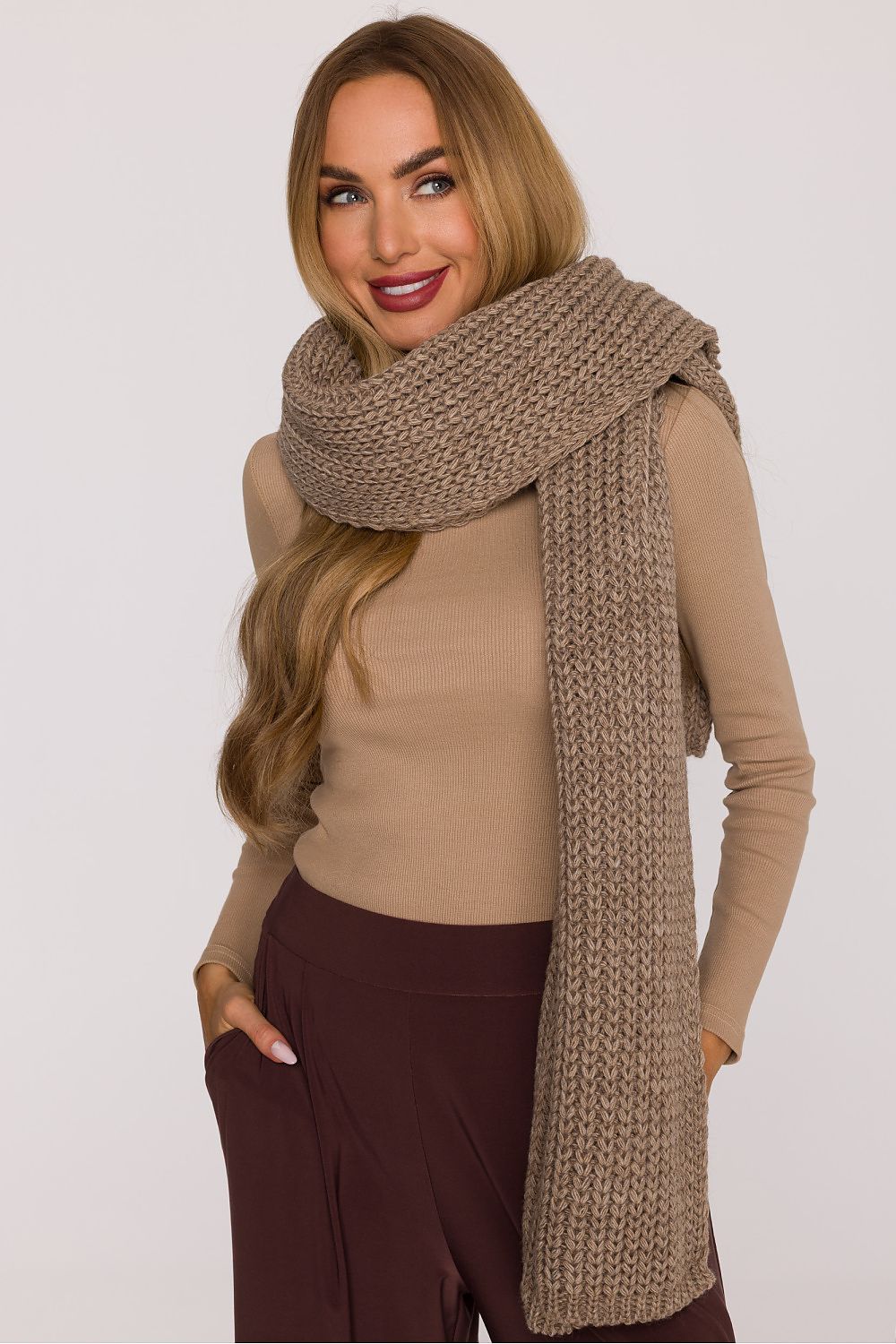 Moe's elegant ribbed shawl styled for a chic look, perfect for both casual and formal occasions.