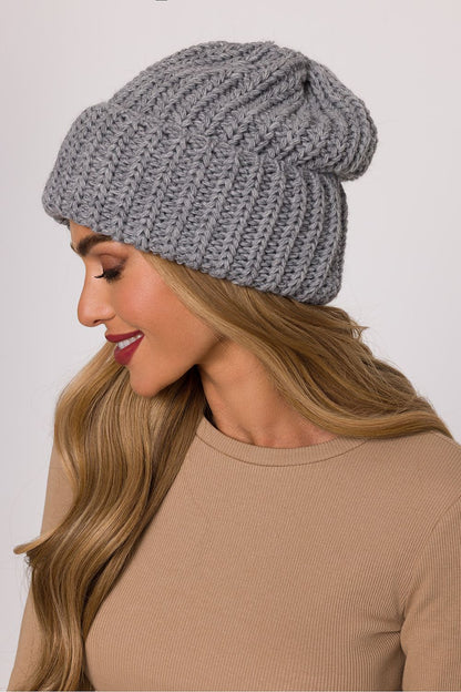Close-up of the luxurious ribbed texture of Moe's soft knit cap, highlighting its warm and stylish design.