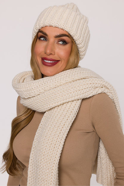 The folded edge of Moe's luxury knit cap providing a perfect fit and warmth, ideal for a chic winter accessory.