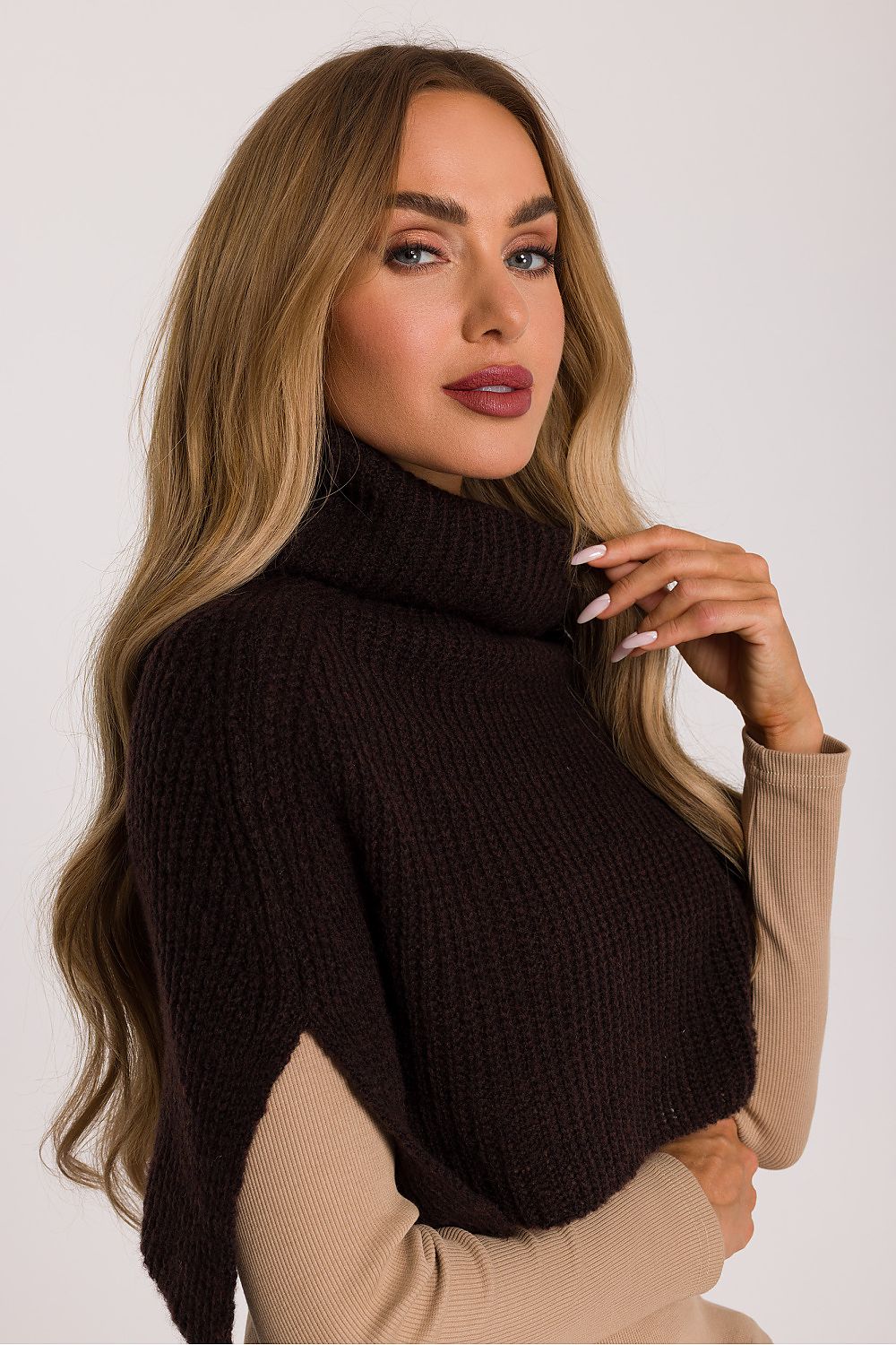 Model wearing the Moe infinity scarf wrapped around the neck, demonstrating its soft yarn and snug fit, perfect for cold weather elegance.