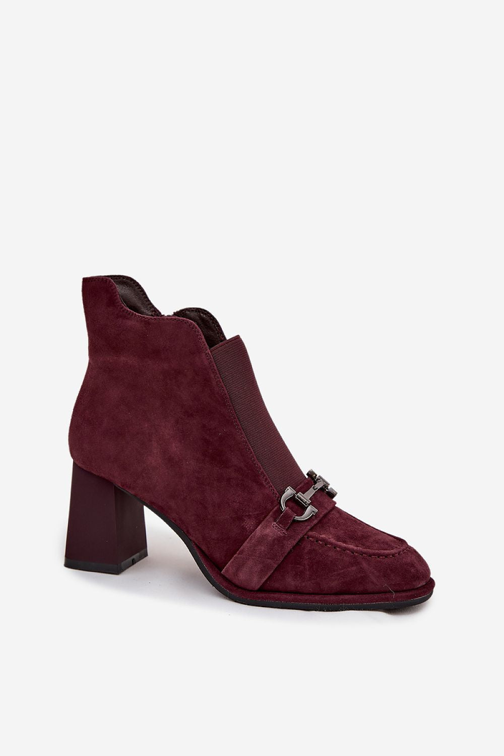 Chic Artiker suede ankle boots showcasing a comfortable column heel and decorative strap detail, ideal for both casual and formal occasions.