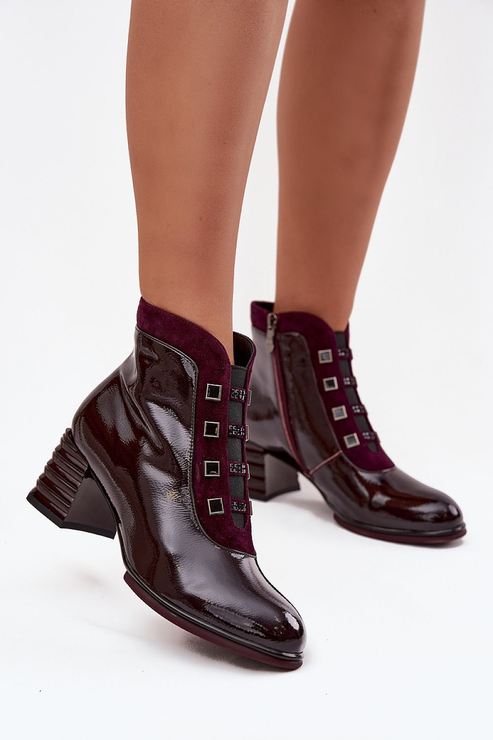 Elegant women's patent leather ankle boots by Step in Style, featuring a stylish rounded toe design and a convenient zipper closure, ideal for both casual and formal outfits in sizes EU 36-40.