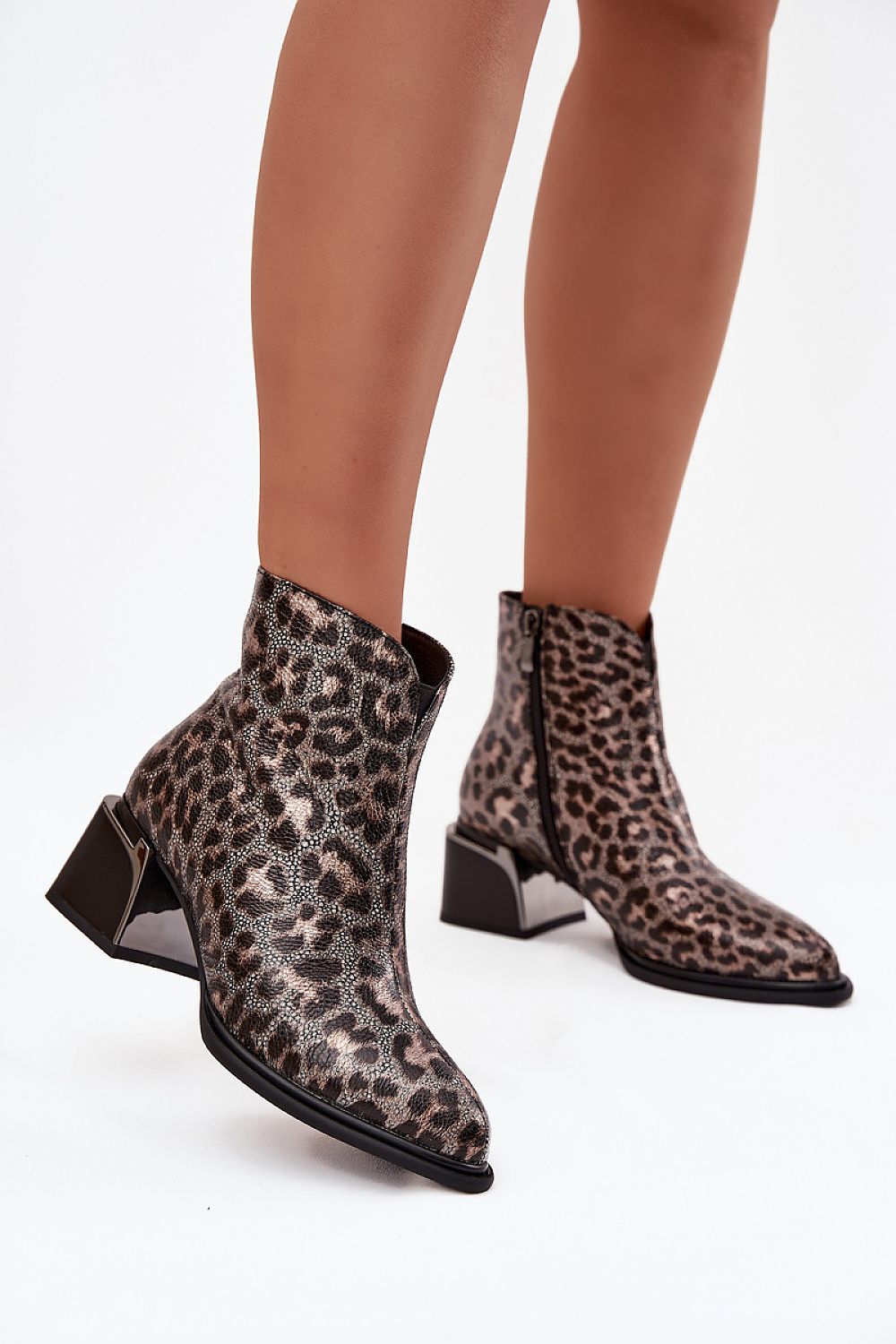 Elegant women's ankle boots by Step in Style, crafted from natural leather featuring a chic leopard design, block heel, and sleek almond toe.