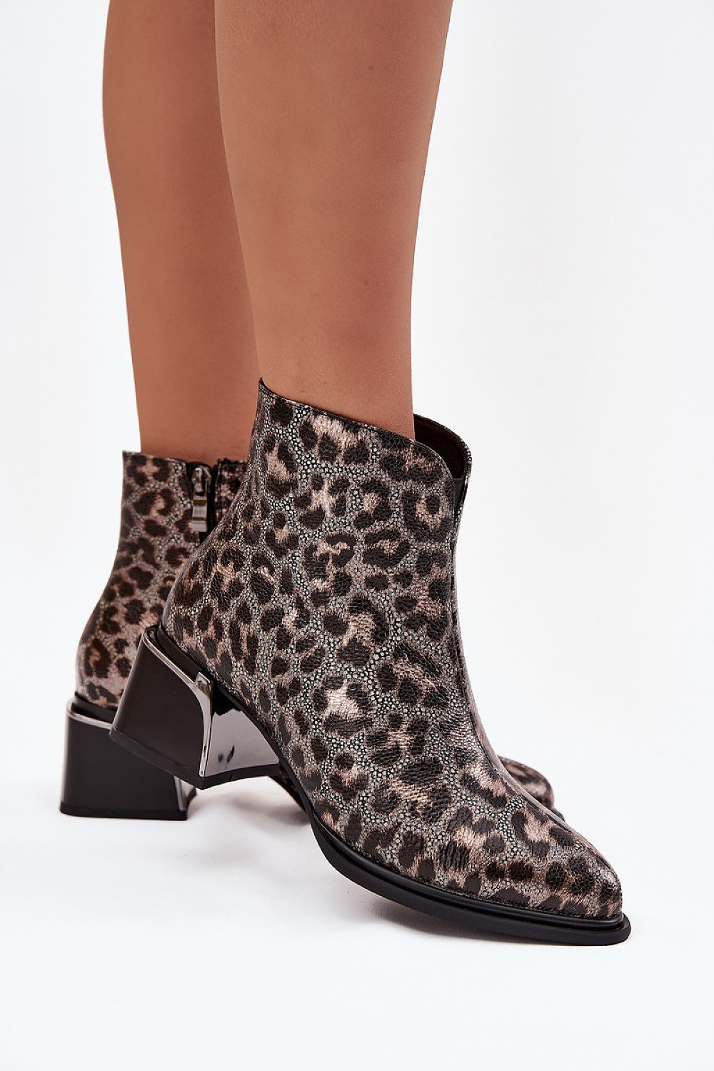 Luxurious natural leather ankle boots for women by Step in Style, designed with a striking leopard pattern and practical zip closure, perfect for autumn-winter wear.