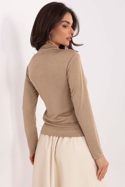 Stylish female model wearing Rue Paris elegant turtleneck blouse, perfect for formal occasions and parties.