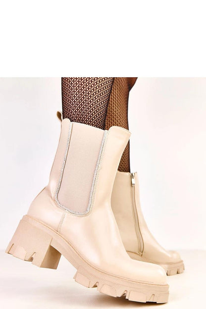 Close-up view of Solea women's ankle boots showcasing luxurious zircon embellishments and comfortable elastic insert for a perfect fit.