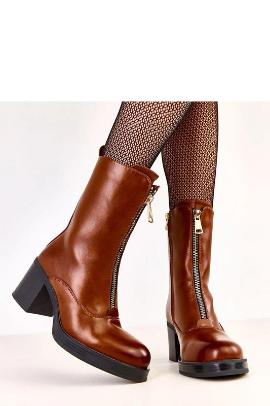Elegant Solea women's ankle boots with a modern design, showcasing a decorative front zipper and a comfortable 19 cm shaft height ideal for chic styling.