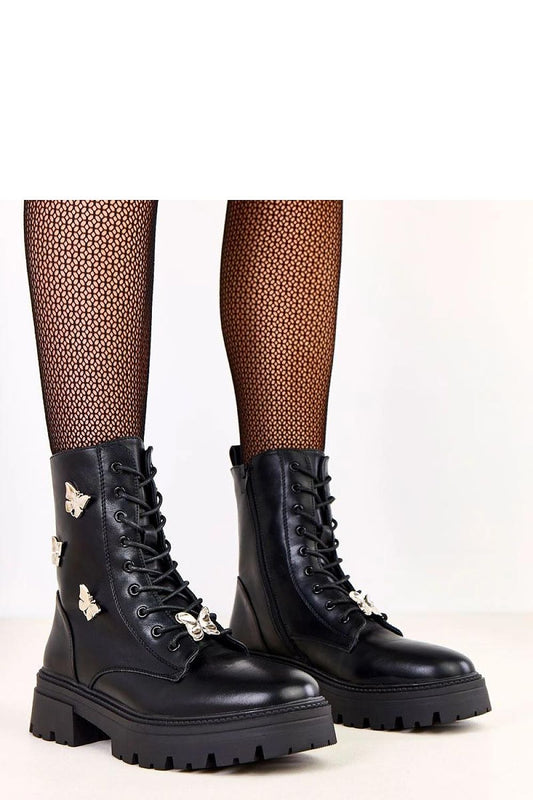 Solea stylish women's ankle boots featuring a round toe design, adorned with charming butterflies detail, a luxurious 5 cm heel, and crafted from high-quality synthetic leather for comfort and durability.