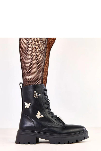 Discover the perfect blend of style and comfort with Solea's stylish ankle boots, designed with delicate butterfly embellishments and a durable synthetic insole, elevating your everyday look.