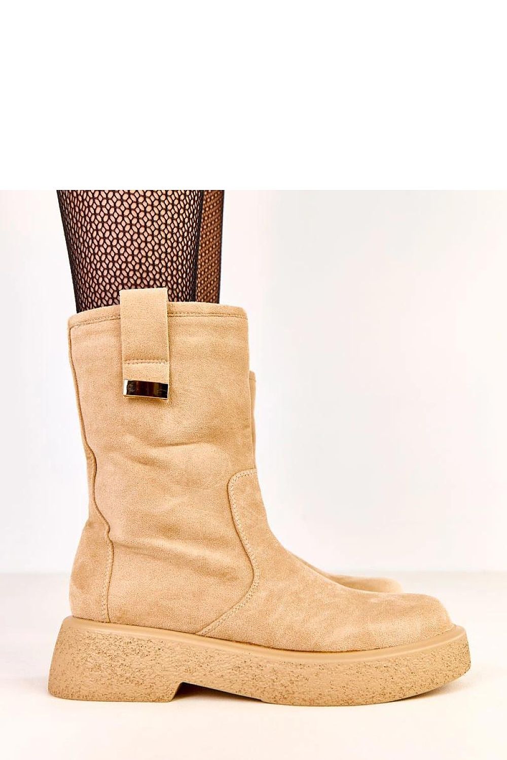 Close-up detail of Solea women's ankle boots, showcasing the luxurious ecological suede finish and minimalist metal decoration.