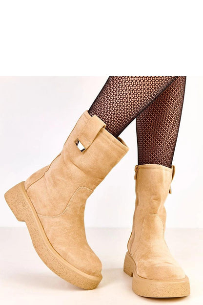 Solea women's ankle boots displayed with stylish outfits, highlighting their versatility and modern design suitable for elegant and casual occasions.