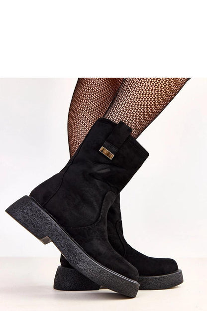 Elegant Solea women's ankle boots displayed on a stylish surface, emphasizing the soft faux suede and inviting comfort for various occasions.