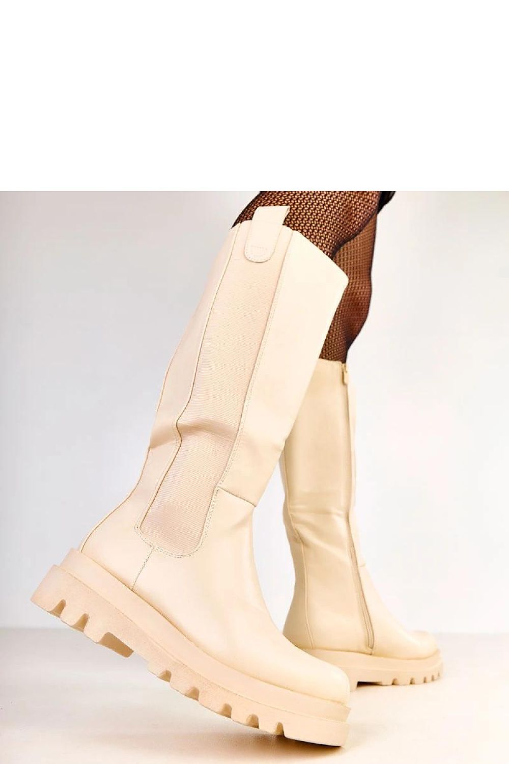 Luxurious thigh-high boots for women by Solea, showcasing a classic round toe and elastic insert for a perfect fit, perfect for stylish outfits.