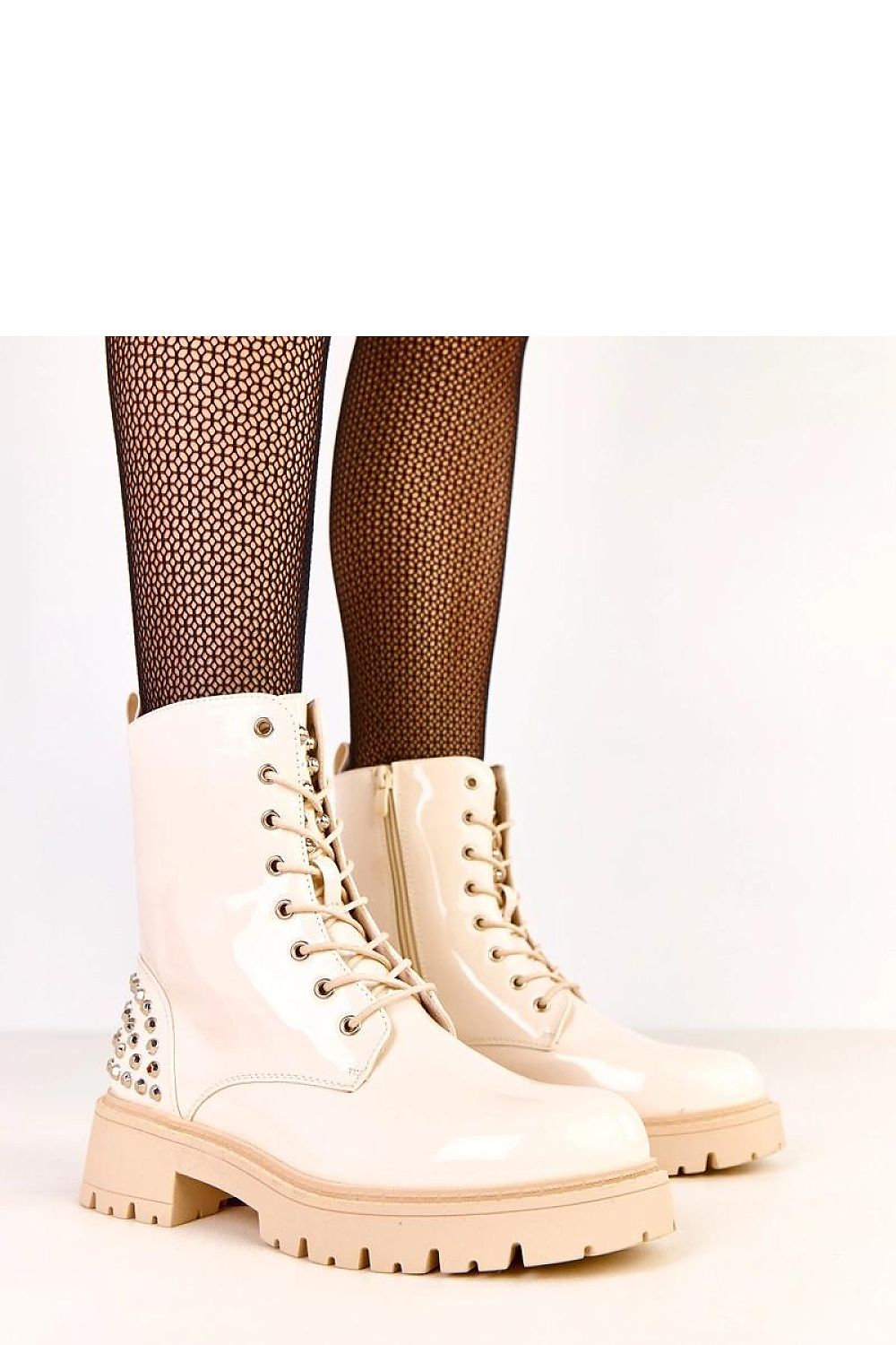 Solea stylish women's ankle boots in patent eco-leather featuring a 5.5 cm heel, perfect for adding a touch of luxury to casual outfits.