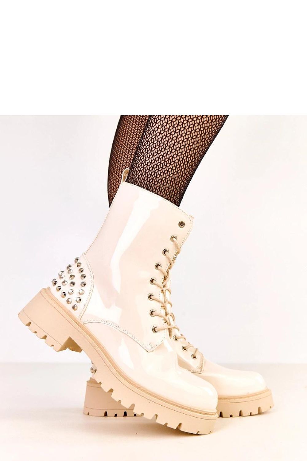 Solea Stylish Women's Ankle Boots in glossy patent eco-leather featuring a 5.5 cm heel and decorative detail, ideal for adding a modern touch to urban fashion.