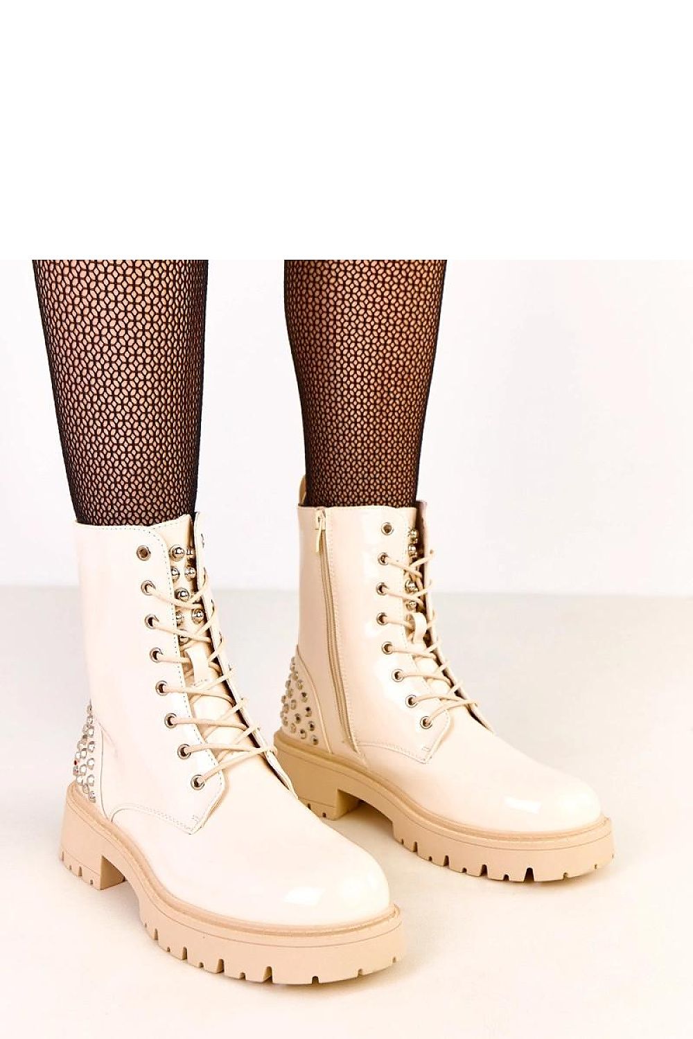 Elegant Solea Women's Ankle Boots made from eco-friendly patent leather, designed for comfort with a round toe and 5.5 cm heel, perfect for sophisticated casual styling.