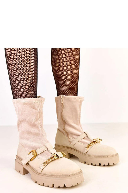 Elegant women's ankle boots by Solea, featuring insulation and a chic side zipper, crafted from soft suede-like synthetic leather for luxury and comfort.