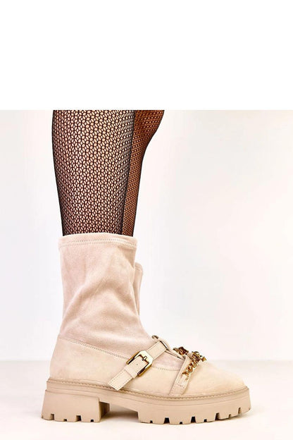 Stylish Solea ankle boots with decorative buckle, a unique teddy bear pendant chain, and 20 cm upper height, perfect for a fashionable look.