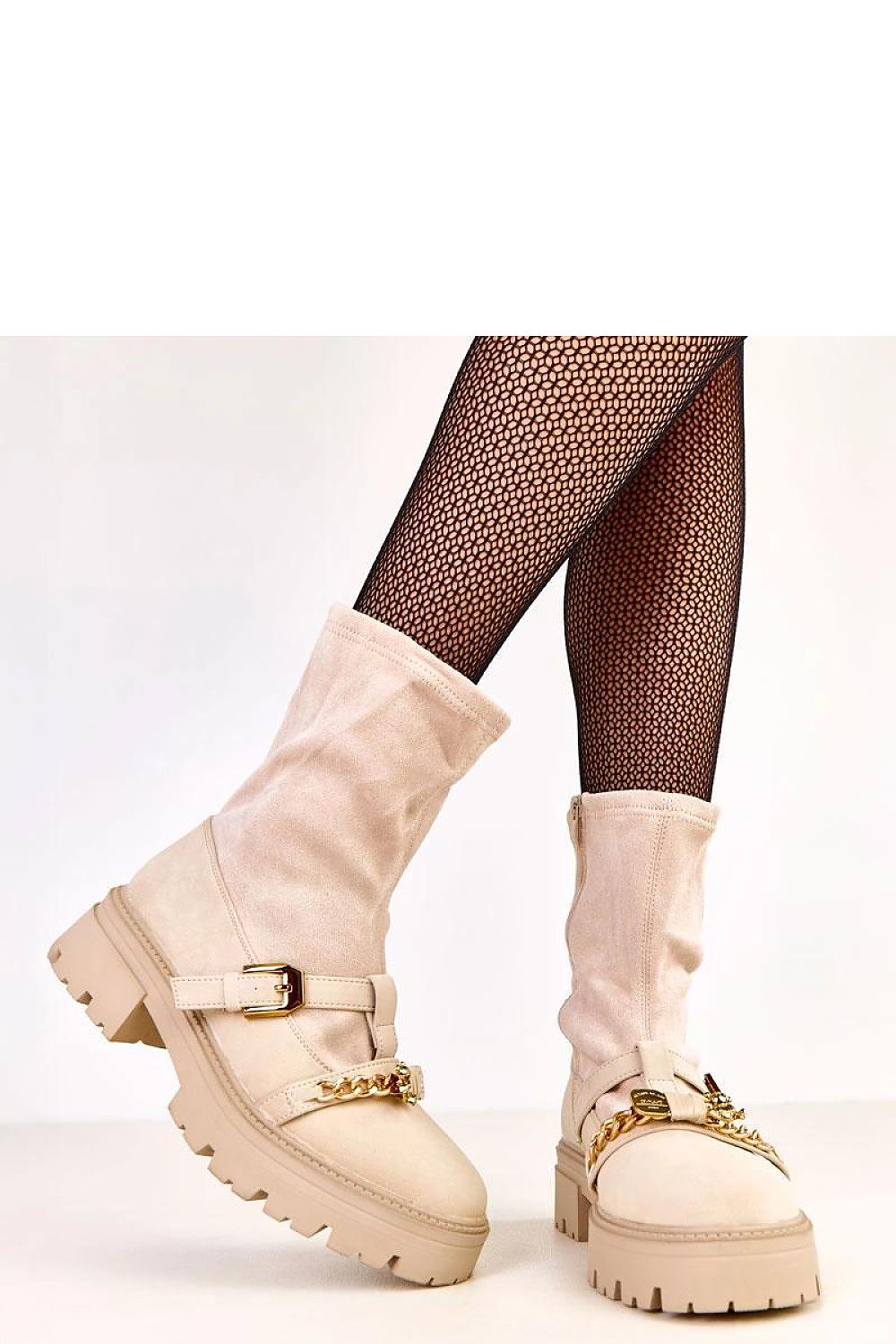 Solea women's ankle boots showcasing elegant design, round toe, and low platform, ideal for everyday wear with a touch of sophistication.