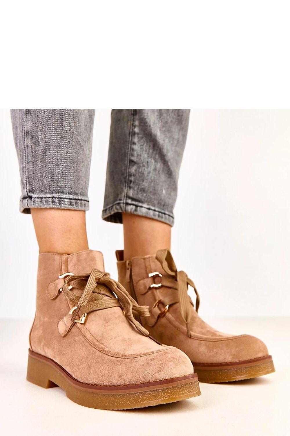 Solea Women's stylish ankle boots crafted from suede-like eco leather, showcasing decorative laces and a fashionable design, perfect for elegant outings.