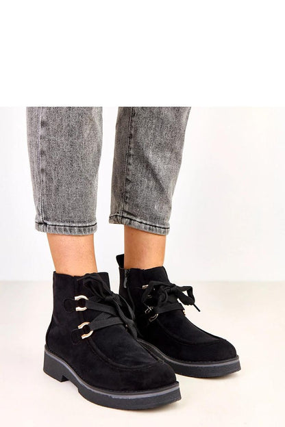 Close-up of Solea Women's ankle boots showcasing fashionable decorative laces and a comfortable round toe design, ideal for chic autumn outings.