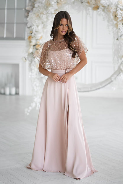 Elegant long dress by Bicotone featuring thin straps and a glamorous sequin bolero with a lovely rose accent, perfect for special occasions.