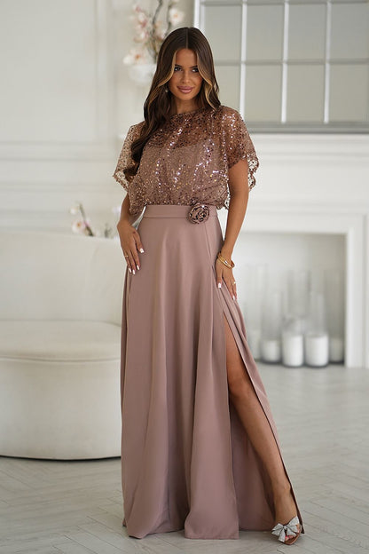Elegant long dress by Bicotone featuring thin straps and a shiny sequin bolero, perfect for evening outings and special occasions.