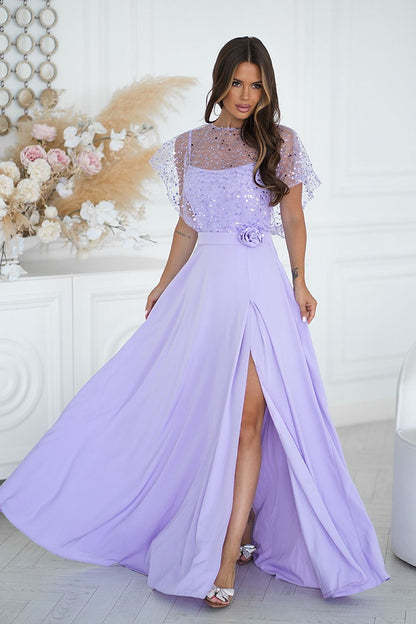 Close-up of the Bicotone sequin bolero embellished with a rose on the belt, complementing the elegant long dress for a luxurious look.