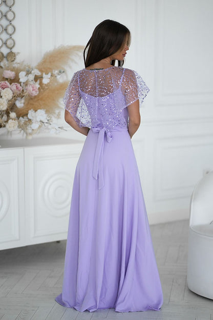 Elegant long dress with sequin bolero by Bicotone, featuring thin straps and a shimmering finish, perfect for special occasions. Available in sizes EU 38-48.