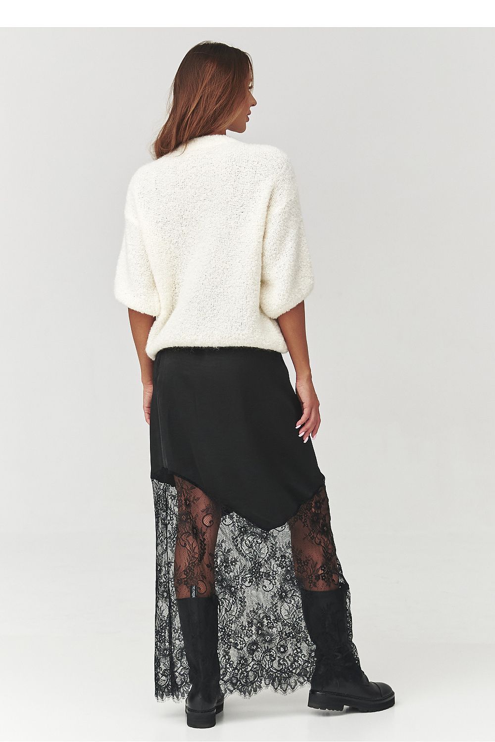 Elegantly draped Makadamia jumper in deep chocolate colour, exemplifying chic comfort for cool days.