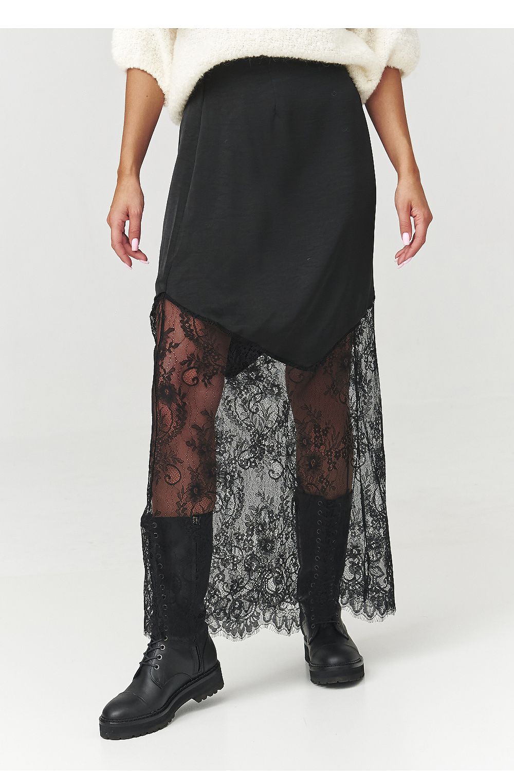 Elegant black long skirt with exquisite lace detail by Makadamia, showcasing a unique asymmetrical cut, perfect for sophisticated women's fashion. Available in sizes EU 36-40 | US 4-8, this luxurious skirt adds a touch of character to both evening and casual outfits.