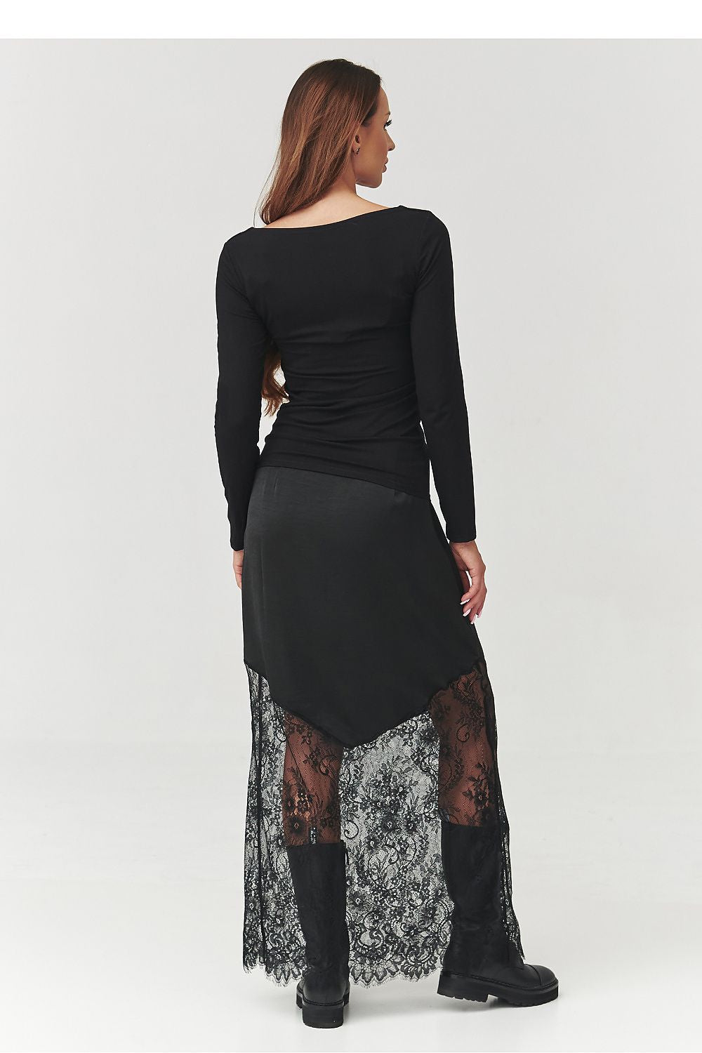 Luxe black skirt with flowing silhouette and transparent lace accents by Makadamia, perfect for evening wear and stylish everyday outfits.
