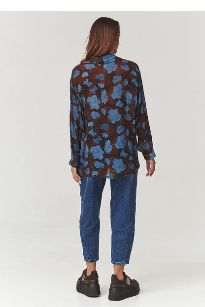 Elegant floral long sleeve shirt by Makadamia, showcasing a flowing silhouette and subtle collar, crafted from lightweight material, perfect for a chic casual or office look.