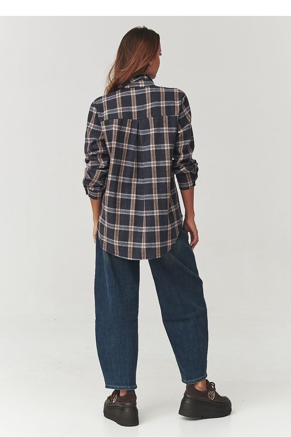 Detail of the Makadamia Long Sleeve Cotton Plaid Shirt, highlighting the soft cotton fabric and sophisticated loose silhouette for timeless elegance.