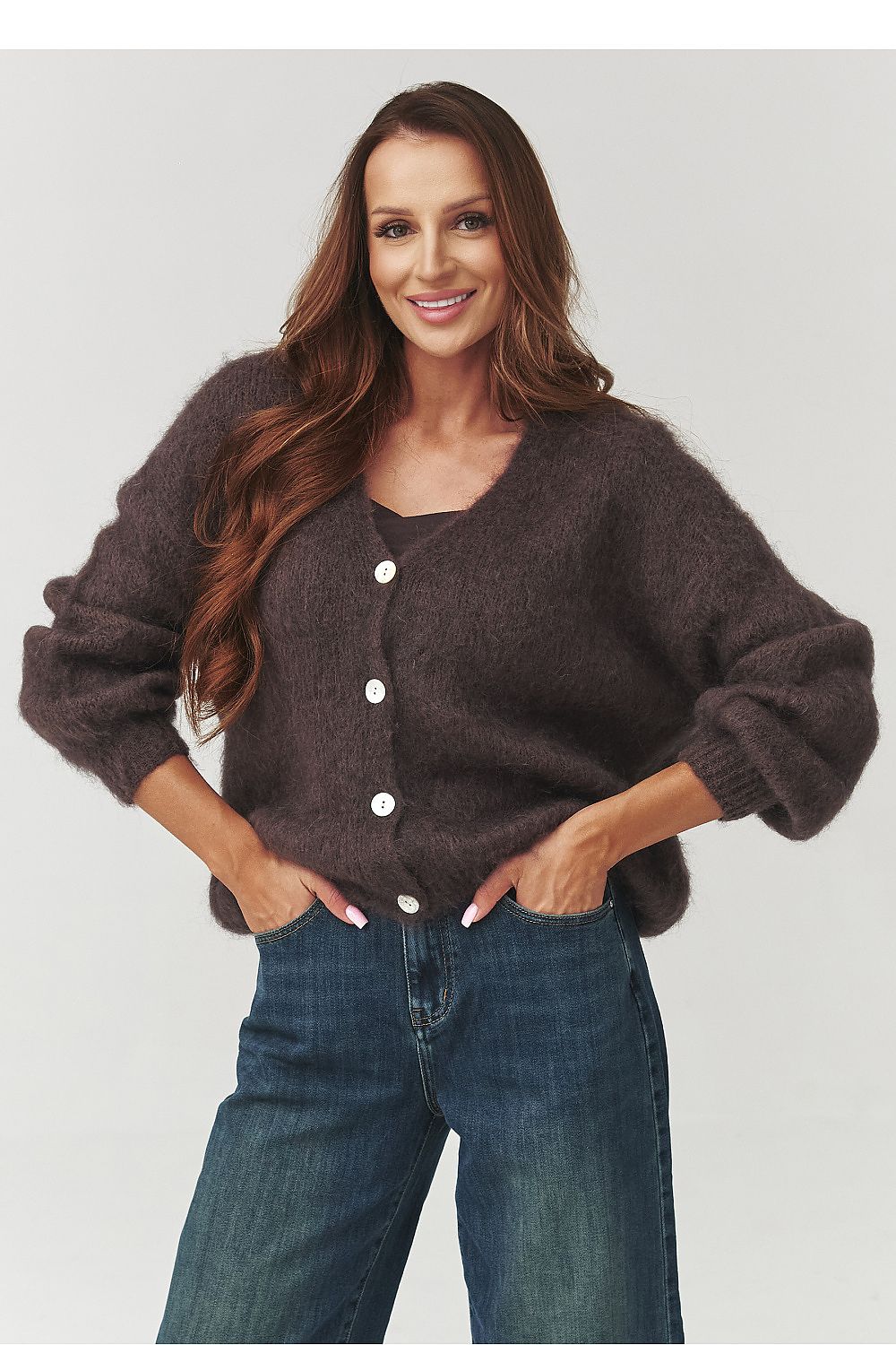 Versatile Makadamia oversized cardigan styled with jeans, capturing the essence of casual yet elegant fashion.