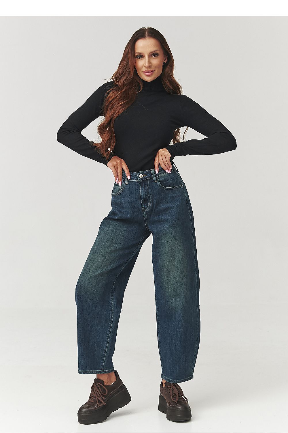 Stylish Makadamia Women's Luxury Turtleneck Golf Top in rich burgundy, perfect for fashionable golfing or casual outings.