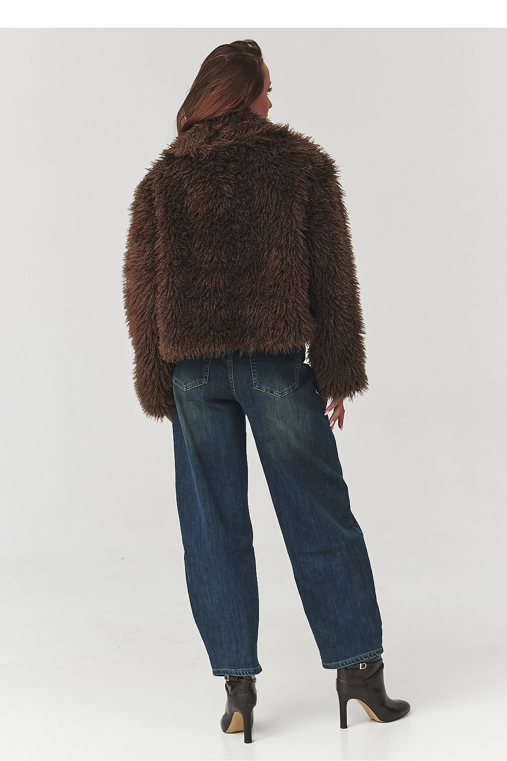 Luxurious Makadamia women's fur jacket showcasing soft, fluffy fur in black, perfect for stylish winter outfits.