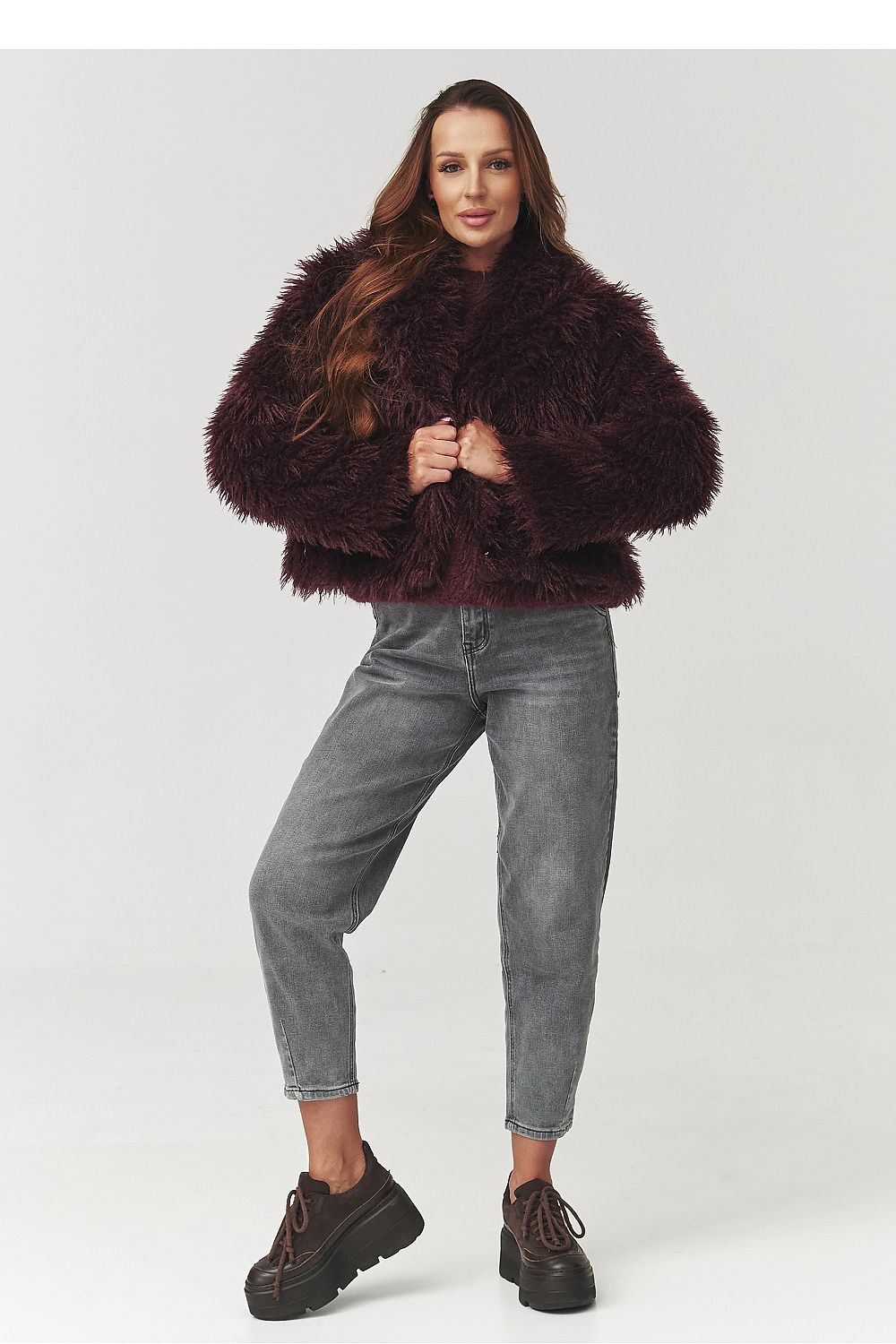 Trendy brown fur jacket by Makadamia, highlighting a stylish short cut that enhances the waist, suitable for both casual and elegant wear.